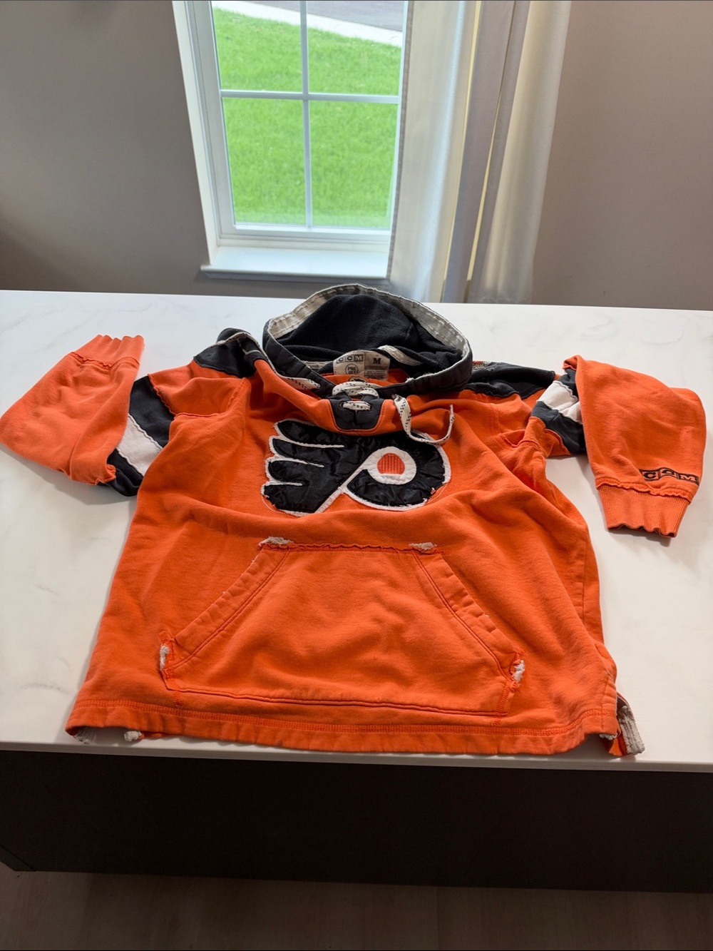 CCM Orange and Black Kids Hockey Hoodie with Team Logo